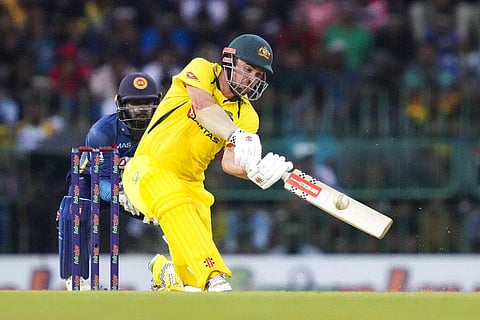 Australia's Travis Head plays a shot as Sri Lanka's Niroshan Dickwella watches during the third one-day international in Colombo. (Photo | AP)