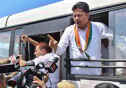 Assam Pradesh Congress Committee President Bhupen Kumar Borah being detained by police during a protest against rebel Shiv Sena leader Eknath Shinde, in Guwahati, on June 24, 2022. (Photo | PTI)