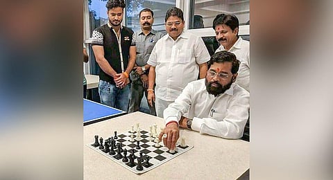 Rebel Shiv Sena leader Eknath Shinde plays chess at a hotel in Guwahati. (Photo | PTI)