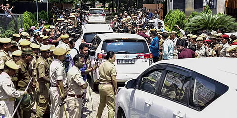 Police personnel guard outside a hotel as rebel Shiv Sena MLAs arrive, in Guwahati. (Photo| PTI)