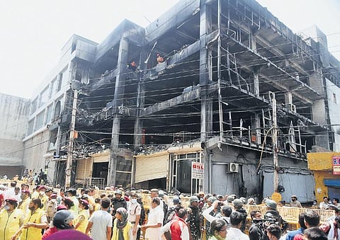 Rescue workers at the gutted building in Mundka. (File photo)