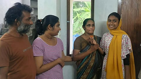 Finu Sherin (right) with Vishnu’s family at Mayanad in Kozhikode.