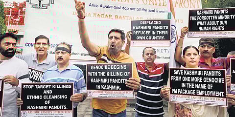 Members of Kashmiri Pandit United Front raise slogans during a protest on the occasion of World Refugee Day, in Jammu recently | file picture