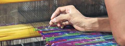 An artisan working with discarded fabric at the Paiwand studio in Noida.