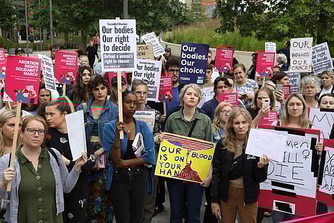 Demonstrators gather outside the United States embassy in Vauxhall to protest against the decision to scrap constitutional right to abortion. (Photo | AP)