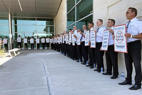 Southwest Airlines pilots picket outside the terminal at Dallas Love Field on June 21, 2022, in Dallas. (Photo | AP)