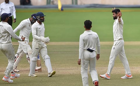 Madhya Pradesh bowler Kumar Kartikeya celebrates with teammates after the wicket of Mumbai batter Hardik Tamore. (Photo | PTI)