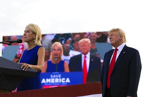 U.S. Rep. Mary Miller, of Illinois, speaks as former President Donald Trump stands behind her on stage at a rally at the Adams County Fairgrounds in Mendon. (Photo | AP)
