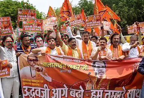 Shiv Sena supporters stage a protest in support of Chief Minister of Maharashtra Uddhav Thackeray, at Jantar Mantar, in New Delhi. (Photo | PTI)