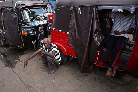 People wait in a queue hoping to get fuel near a fuel station in Colombo, Sri Lanka. (Photo | AP)