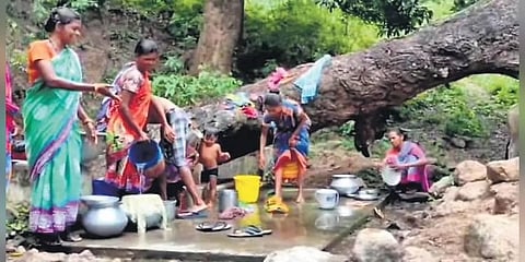 Women washing utensils near the stream in Baliganda | Express