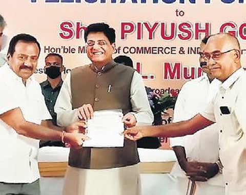 Representatives of the Dyers Association of Tiruppur give a petition to Union minister Piyush Goyal on Sunday. (Photo | Express)
