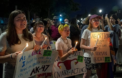Abortion-rights protesters participate in a candlelight vigil for reproductive freedom and abortion rights outside the Supreme Court in Washington. (Photo | AP)
