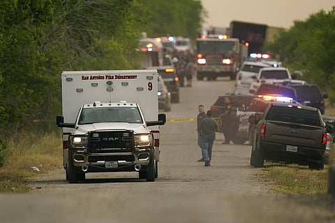 An ambulance leaves the scene where police said dozens of people were found dead in a semitrailer in a remote area in southwestern San Antonio, Monday, June 27, 2022(Photo | AP)