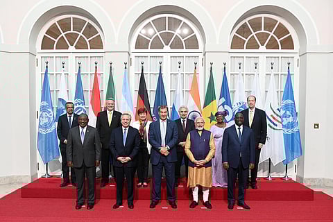 The 48th G7 Summit attendees pose for a group photo at a reception in the Residence. (Photo | PTI)