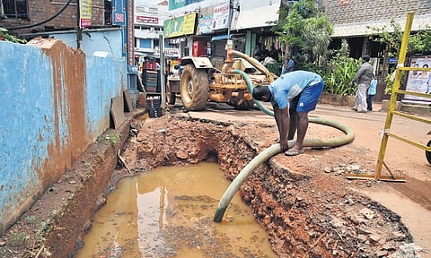 Water being drained out from a stormwater drain under construction on Perumal Koil Street in Kavangarai on Saturday | P JAWAHAR