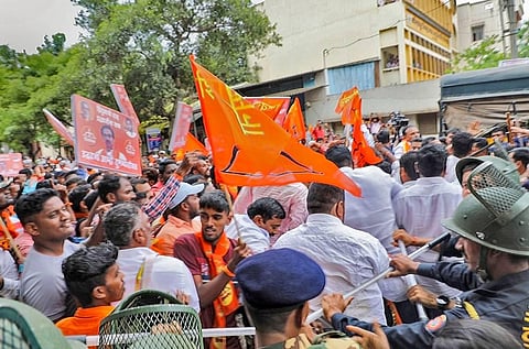 Shiv Sena workers stage a protest against rebel Maharashtra Minister Rajendra Patil-Yadravkar, who is camping with Eknath Shinde-led group in Guwahati, outside his office in Kolhapur. (Photo | PTI)