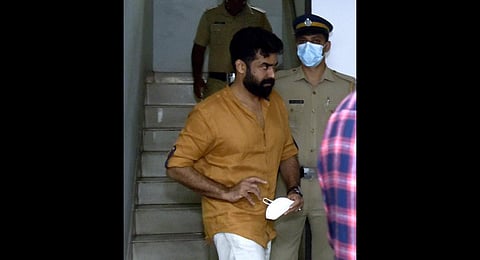 Actor-producer Vijay Babu being taken for quizzing to the Thevara police station on Monday | A Sanesh