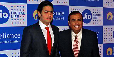 Reliance Industries chairman Mukesh Ambani (L) and son Akash. (Photo| Twitter)