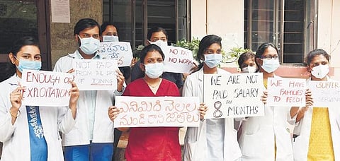 Doctors stage a protest demanding payment of salaries on Tuesday