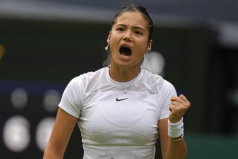 Britain's Emma Raducanu celebrates winning a point against France's Caroline Garcia during their singles tennis match against on day three of the Wimbledon tennis championships in London. (Photo | AP)