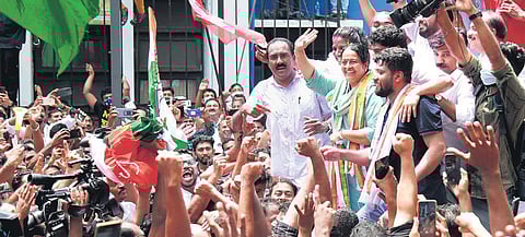 Thrikkakara MLA-elect Uma Thomas of UDF greeting party workers outside Maharaja’s College in Kochi, where the counting of votes was held, after the bypoll result was announced | T P Sooraj
