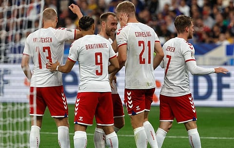 Denmark's Andreas Cornelius, right, challenges for the ball with France's William Saliba during the UEFA Nations League soccer match between France and Denmark. (Photo | AP)