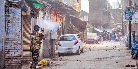 Police use tear gas to disperse people amid clashes in Kanpur on Friday | PTI