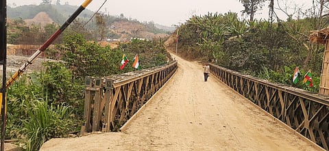 A person is seen walking towards India from the Myanmar side along the under-construction bridge. (Representational Photo | Express)