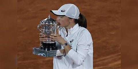 Poland's Iga Swiatek kisses the cup after defeating Coco Gauff of the U.S.in their final of the French Open tennis tournament at the Roland Garros stadium Saturday, June 4, 2022 in Paris. (Photo | AP)