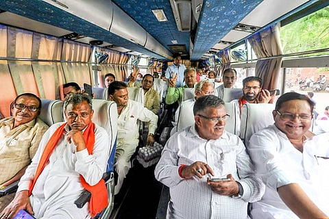 Bharatiya Janata Party (BJP) MLAs board a bus and head to Jamdoli ahead of the Rajya Sabha Elections, in Jaipur. (Photo | PTI)