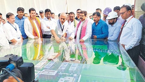 Pradhan being shown a presentation on the 3D model of IIM-S campus on Sunday. (Photo | EPS)