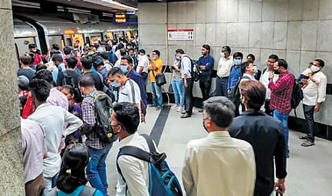 A large crowd awaits their turn to board the Metro at Mandi House station on Monday | pti