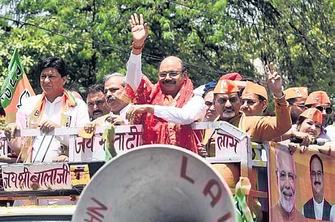 AAP candidate Durgesh Pathak and BJP candidate Rajesh Bhatia on their way to file nomination for Rajendra Nagar by-election on Monday | parveen negi