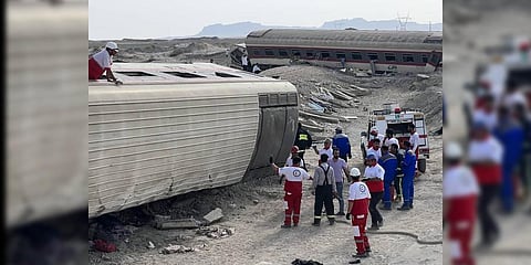 In this photo provided by Iranian Red Crescent Society, rescuers work at the scene where a passenger train partially derailed near the desert city of Tabas.(Photo | AP)