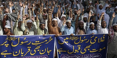 People chant anti-India slogans to condemn the derogatory references to Prophet Muhammad in Karachi, Pakistan, Monday.(Photo | AP)