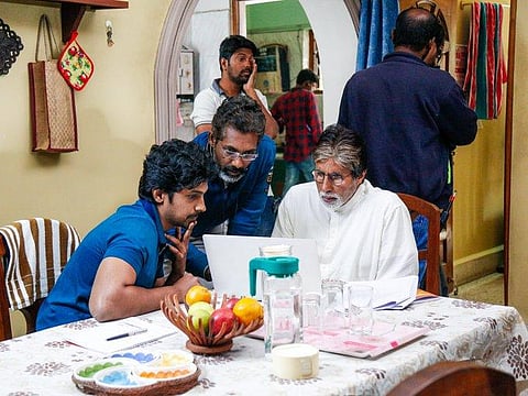 Arjun Radhakrishnan with Nagraj Manjule and Amitabh Bachchan in Jhund.