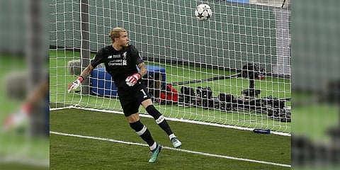 Liverpool goalkeeper Loris Karius looks at the ball after a fumble allowed Gareth Bale to score his side's 3rd goal during the CL final against Real Madrid.May 26, 2018.(Photo | AP)