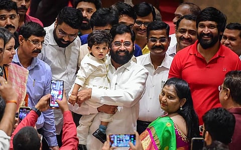 Maharashtra CM and Shiv Sena leader Eknath Shinde arrives with his grandson. (Photo | PTI)