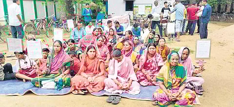 Guardians sit on dharna in front of Kujang block education office. (Photo | Express)