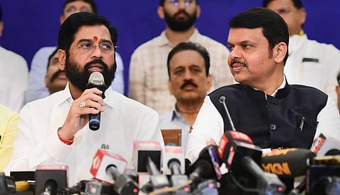 Maharashtra CM and Shiv Sena leader Eknath speaks as Deputy CM and BJP leader Devendra Fadnavis looks on during a press conference, in Mumbai. (Photo | PTI)
