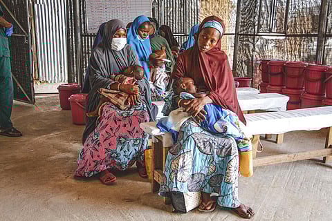 Mothers wait with their malnourished mhildren at the Inpatients Therapeutic Feeding Center in Maiduguri, Nigeria. (Photo | AP)
