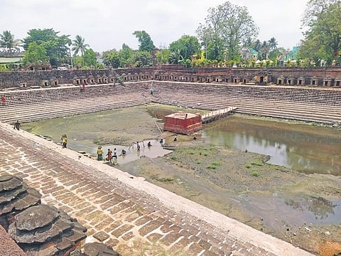 Workers busy at work as they clean the Sahasralinga tank | Express