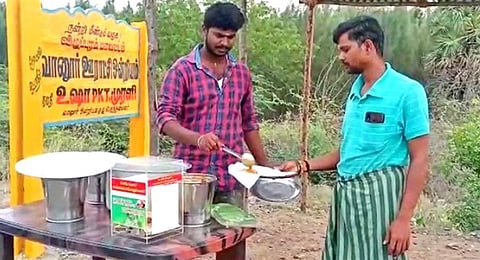 Customers enjoy a free meal at a stall set up by Sekar Poovarasan at Tindivanam. (Photo | EPS)