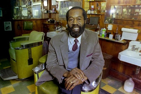 Vernon Winfrey, father of Oprah Winfrey, sits in one of the chairs in his barber shop in Nashville, Tennessee, in 1987. (Photo | AP)