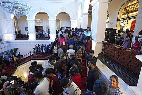 Protesters look around at the president's official residence a day after it was stormed in Colombo, Sri Lanka, Sunday, July 10, 2022. (Photo | AP)