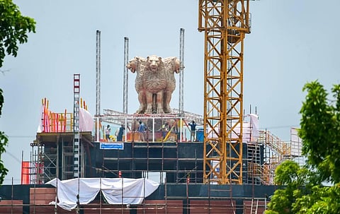 View of the national emblem, which was unveiled by Prime Minister Narendra Modi cast on the roof of New Parliament House building, in New Delhi. (Photo | PTI)
