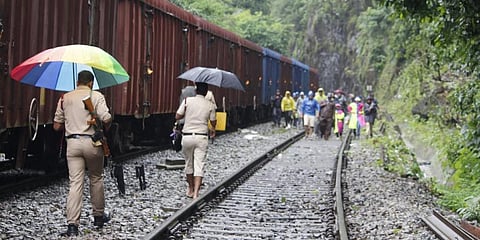 The RPF officials sending back a group of tourists at Dudhsagar railway station. (Photo | Express)