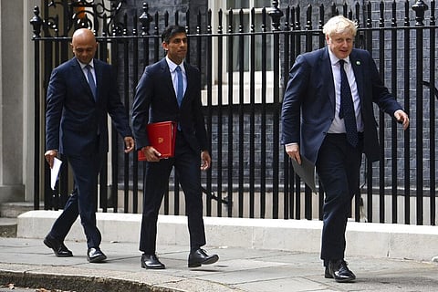From left, British Health Secretary Sajid Javid, Chancellor of the Exchequer Rishi Sunak and Prime Minister Boris Johnson arrive at No 9 Downing Street. (Photo | AP)