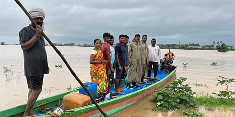 Villagers try to come out of flood waters in Andhra Pradesh's Rajamahendravaram. (Photo| EPS)